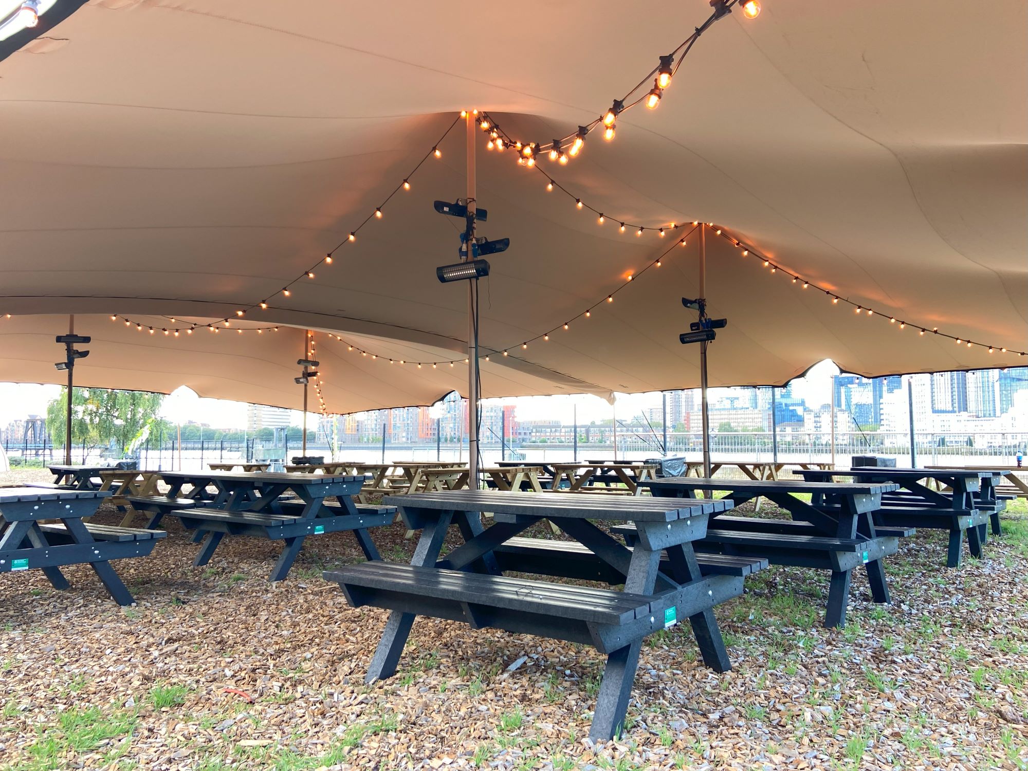 Outdoor stretch tent with festoon